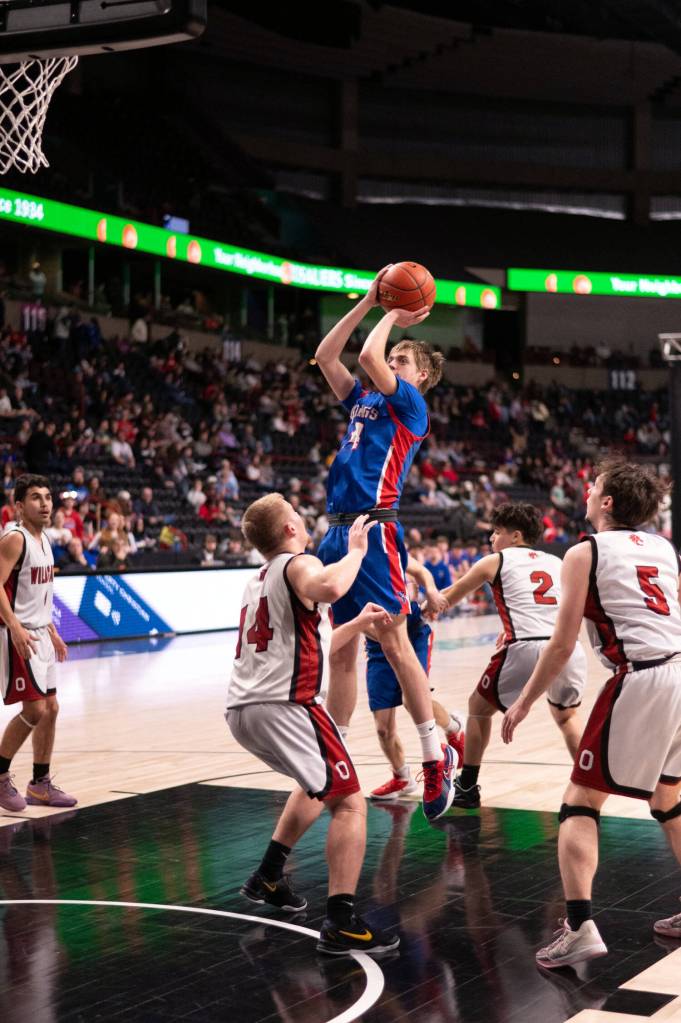 PHOTO BY TIA CHANNELL Willapa Valleys J.B. Russell pulls up for a jump shot against Ocostas Jayden Turner during the Vikings 51-46 victory in a 1B State Tournament game on Friday in Spokane.