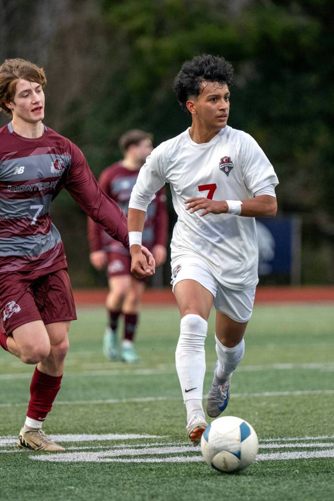 PHOTO BY FOREST WORGUM Hoquiams J.B. Fabian (right) looks up field in a scrimmage against Montesano during the Montesano Boys Soccer Jamboree on Monday at Montesano High School.