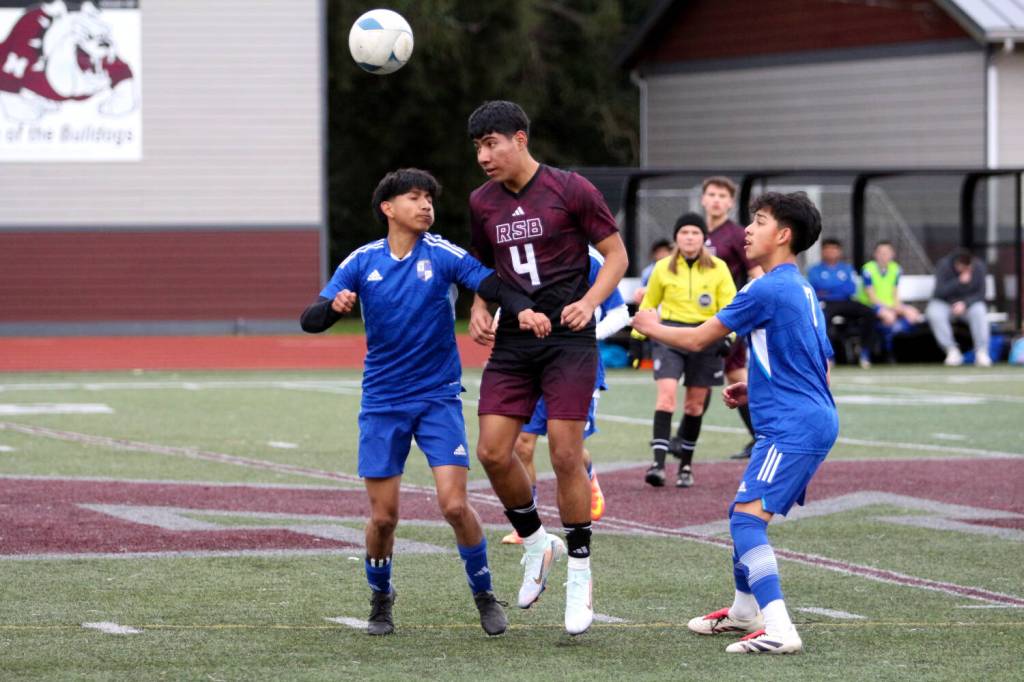 RYAN SPARKS | THE DAILY WORLD Raymond-South Bends Chris Quintana (4) heads the ball during a scrimmage against the Elma Eagles at the Montesano Boys Soccer Jamboree on Monday at Montesano High School.
