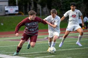 RYAN SPARKS | THE DAILY WORLD Montesanos Felix Romero (left) dribbles the ball during a scrimmage against the Hoquiam Grizzlies during the Montesano Boys Soccer Jamboree on Monday at Montesano High School.
