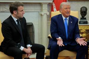 U.S. President Donald Trump hosts French President Emmanuel Macron as they answer questions from journalists in the Oval Office at the White House on Feb. 24, in Washington, D.C. Macron was meeting with Trump in Washington on the third anniversary of Russia's full-scale military invasion of Ukraine. (Chip Somodevilla / Getty Images / TNS)