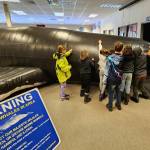 Stori Smith
Students inspect Big Mama, a life-size inflatable humpback whale used by the Olympic Coast National Marine Sanctuary for environmental education.