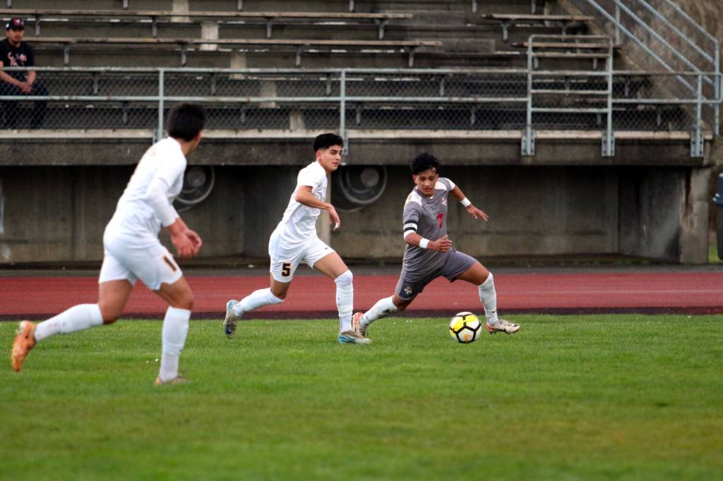 RYAN SPARKS | THE DAILY WORLD Aberdeen midfielder Gilbran Garcia (5) is defended by Hoquiams JB Fabian during the Bobcats 3-1 win on Thursday in Hoquiam.