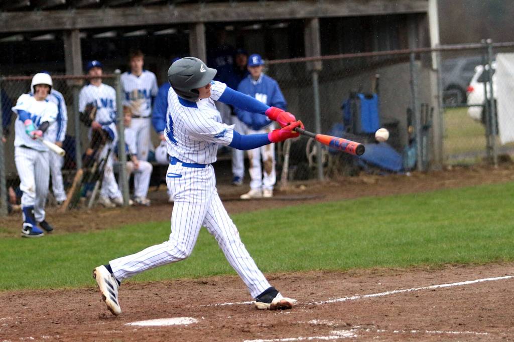 RYAN SPARKS | THE DAILY WORLD Elmas Bryston Crawford smacks an RBI single during an 8-8 tie against Castle Rock on Friday in Elma.