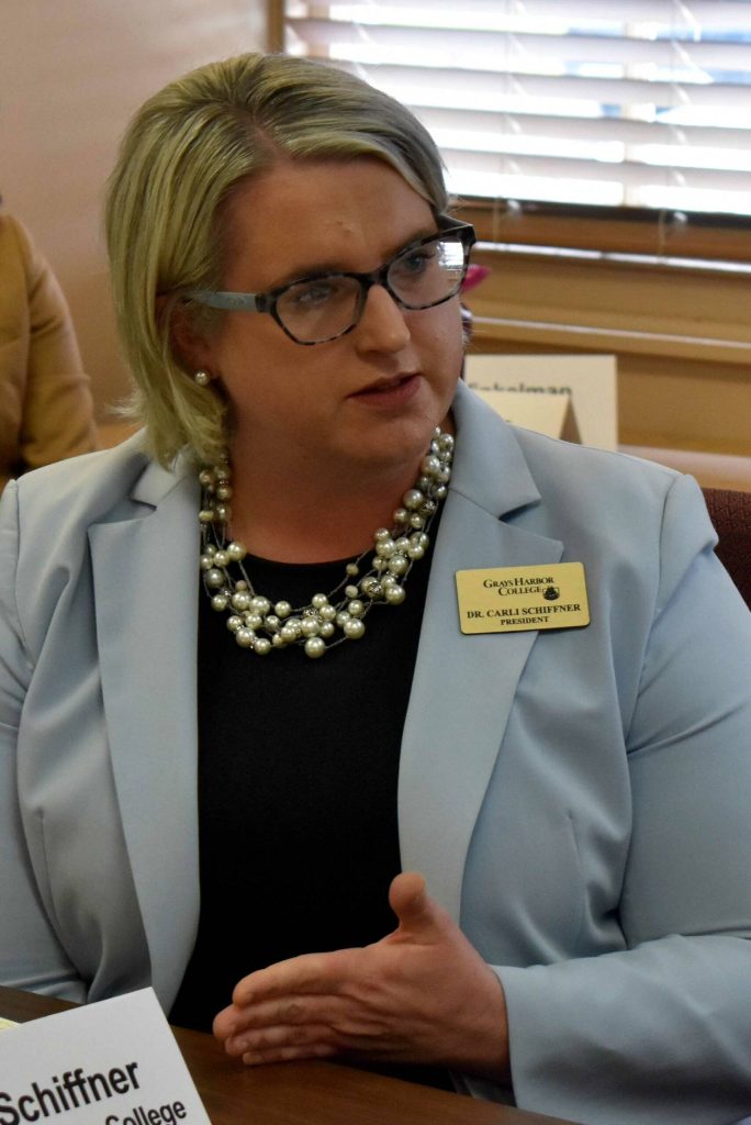 Dr. Carli Schiffner, the president of Grays Harbor College, addresses Gov. Bob Ferguson.