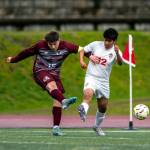 PHOTO BY FOREST WORGUM Montesano forward Felix Romero (15) scores a goal while defended by Hoquiams Gilbert Rodriguez Madrigal during Montes 6-3 win on Tuesday in Montesano.