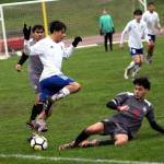 RYAN SPARKS | THE DAILY WORLD Elmas Luis Torres (left) leaps over the slide tackle of Hoquiams Santiago Martinez (9) during the Eagles 5-2 win on Thursday at the Sea Breeze Oval in Hoquiam.