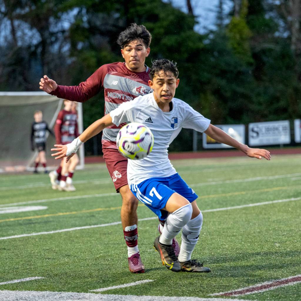 PHOTO BY FOREST WORGUM 
Montesanos Cris Tobar (background) and Elmas Ivan Rodriguez compete for possession during the Bulldogs 1-0 win on Monday in Montesano.