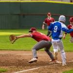PHOTO BY FOREST WORGUM Hoquiam first baseman Ryan Pullar (left) fields a throw as Elmas Colt Landstrom races to first base during the Eagles 10-0 win on Tuesday at Olympic Stadium in Hoquiam.