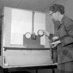 Jones Photo Historical Collection
Gertrude Backstrom splitting bullets on an axe blade.