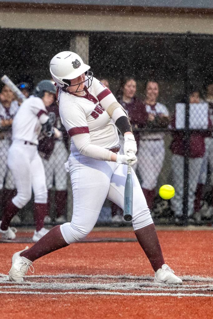 PHOTO BY FOREST WORGUM Montesano first baseman Kylee Wisdom connects for one of her two base hits in an 8-0 win over Lynden Christian on Friday in Montesano.