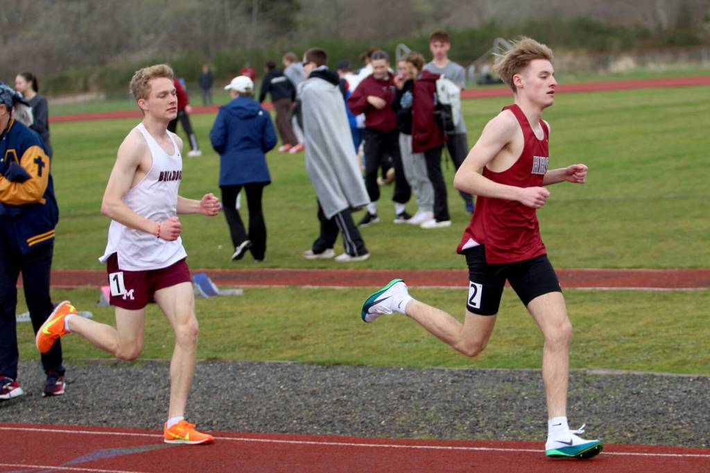 RYAN SPARKS | THE DAILY WORLD Hoquiams Ryker Maxfield (right) leads Montesanos Benny Anderson during the boys 3,200-meter race at the Ray Ryan Memorial Grays Harbor Championships on Saturday at Miller Junior High School in Aberdeen.