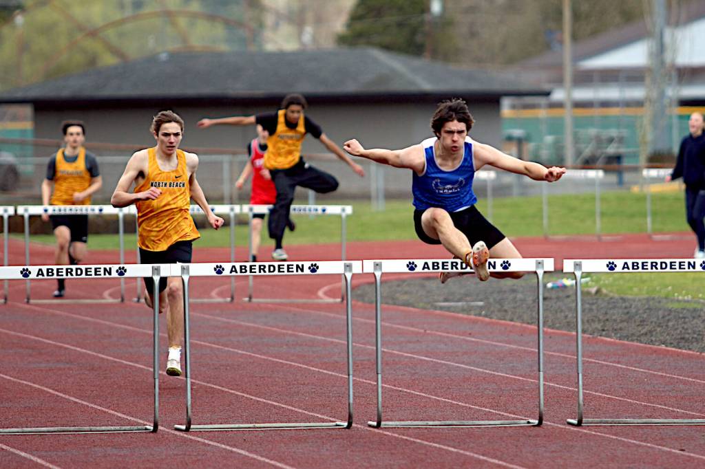 RYAN SPARKS | THE DAILY WORLD Elmas Ryder Nelson (right) leads North Beachs Elton Rockey (second from left) to win the boys 300-meter hurdles at the Ray Ryan Memorial Grays Harbor Championships on Saturday at Miller Junior High School in Aberdeen.