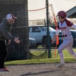PHOTO BY FOREST WORGUM Hoquiams Hailee Burgess (right) is congratulated by Grizzlies head coach Brandon Templer after hitting a home run during a 22-13 loss to Rochester on Thursday at John Gable Park in Hoquiam.