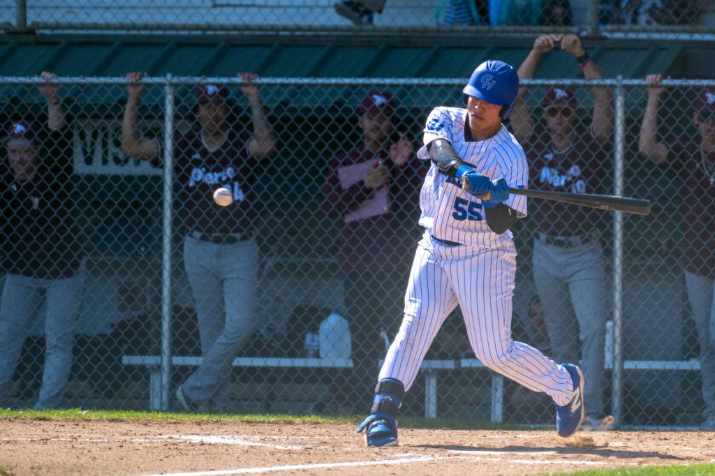 PHOTO BY FOREST WORGUM Grays Harbors Tony Dejesus belts a double during a doubleheader against Pierce College on Saturday in Hoquiam.