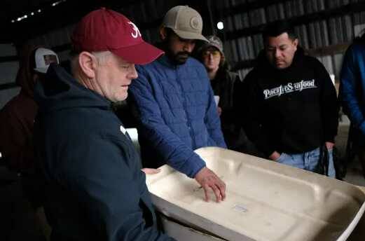 Skills & Drills workshop instructor and fisherman Robert Maw leads a session on fiberglassing.