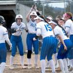NICOLE SHANNON / MAIN FOCUS MEDIA 
Elmas Aubree Simmons (2) is greeted by her teammates after hitting a home run during a doubleheader against Montesano on Tuesday in Elma.