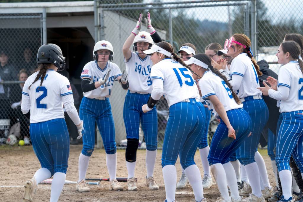 NICOLE SHANNON / MAIN FOCUS MEDIA 
Elmas Aubree Simmons (2) is greeted by her teammates after hitting a home run during a doubleheader against Montesano on Tuesday in Elma.