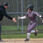 PHOTO BY FOREST WORGUM 
Montesanos Grace Gooding (right) is congratulated by Bulldogs head coach Pat Pace after hitting a home run during a game against Elma on Tuesday in Elma.