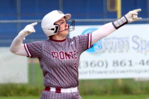 RYAN SPARKS / THE DAILY WORLD 
Montesano catcher Ali Parkin gestures toward her teammates after hitting a two-run double during a game against Elma on Tuesday in Elma.