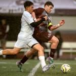 PHOTO BY FOREST WORGUM Raymond-South Bends Michael Nunez (left) and Montesanos Felix Romero compete for possession during the Ravens 6-0 win on Thursday at Jack Rottle Field in Montesano.