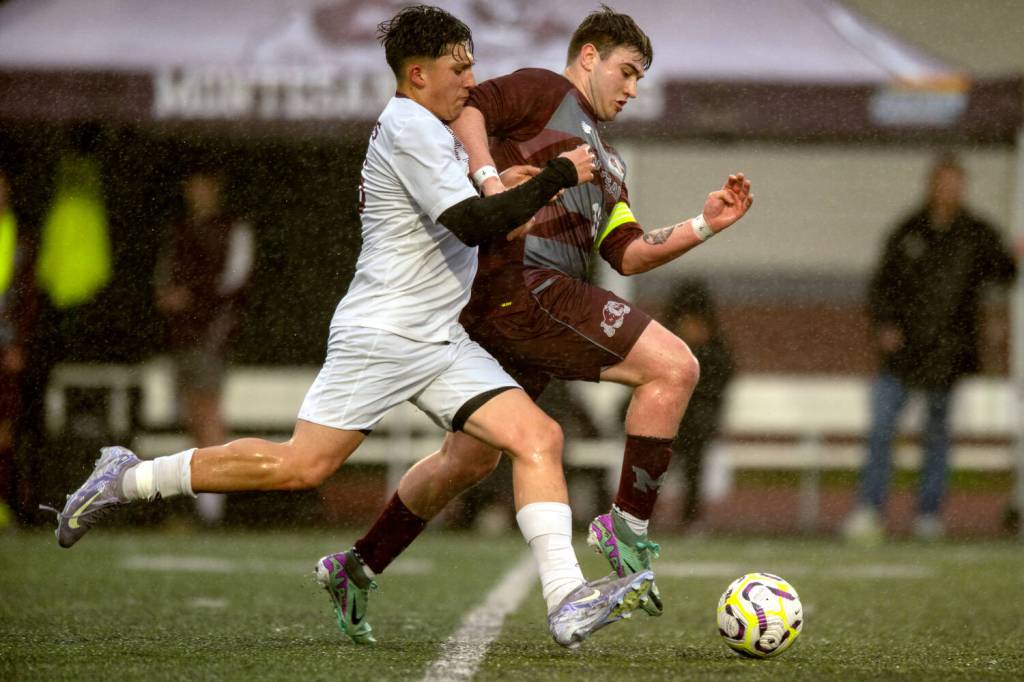 PHOTO BY FOREST WORGUM Raymond-South Bends Michael Nunez (left) and Montesanos Felix Romero compete for possession during the Ravens 6-0 win on Thursday at Jack Rottle Field in Montesano.