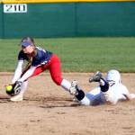 RYAN SPARKS | THE DAILY WORLD Aberdeens Scotlyn Lecomte (right) slides in safely at second base against Black Hills shortstop Kailey Miller during the Bobcats 7-0 win on Friday in Aberdeen.
