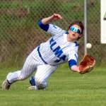 PHOTO BY FOREST WORGUM Elma outfielder Bo Muller makes a diving catch during a doubleheader against Montesano on Friday in Elma.