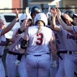 RYAN SPARKS | THE DAILY WORLD Montesano catcher Ali Parkin (3) is greeted by her teammates after hitting a home run during an 11-1 win over Pe Ell-Willapa Valley on Monday in Montesano.