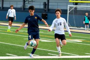 RYAN SPARKS | THE DAILY WORLD Aberdeens Cristhian Lopez (7) holds possession against Tumwaters Josh Alcala during a game on Tuesday at Stewart Field in Aberdeen.