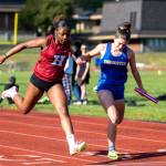 PHOTO BY FOREST WORGUM Hoquiams RenaèJah Burtenshaw (left) edges Rochesters Kailyn Black at the line to give the Grizzlies 4x100-meter relay team a victory in a league meet on Wednesday at the Sea Breeze Oval in Hoquiam.