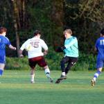 RYAN SPARKS | THE DAILY WORLD Elma goalkeeper Trey Yeager (second from right) makes a play against oncoming Montesano forward Felix Romero (15) during the Eagles 3-2 win on Monday at Davis Field in Elma.