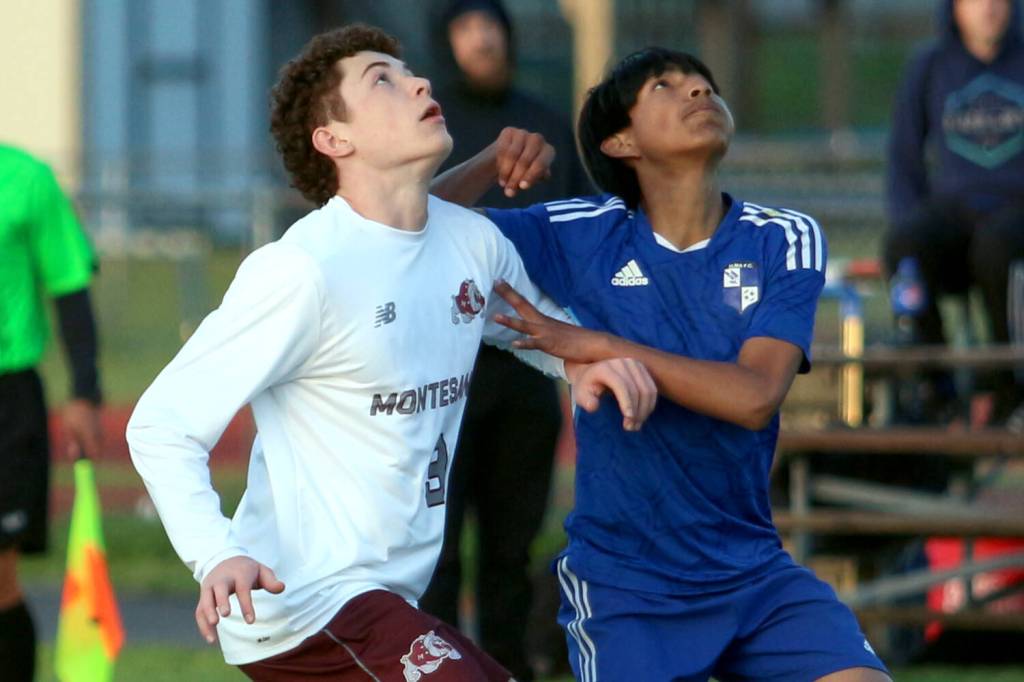RYAN SPARKS | THE DAILY WORLD Montesano defender Terek Gunter (left) and Elma forward Manny Venegas ready to play a ball during the Eagles 3-2 win on Monday at Davis Field in Elma.