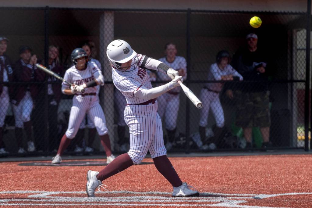 PHOTO BY FOREST WORGUM Montesano catcher Ali Parkin blasts a home run during a 16-5 win over College Place on Saturday at Montesano High School.