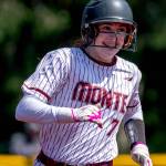 PHOTO BY FOREST WORGUM Montesanos Violet Prince smiles after hitting a walk-off home run in a 16-5 mercy-rule victory over College Place on Saturday in Montesano.