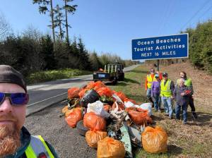CJ Ripley / president Defenders of the Coast
CJ Ripley and the Defenders of the Coast show off their collected trash along state Route 109 on the way to Ocean Shores.