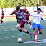 RYAN SPARKS | THE DAILY WORLD Montesano forward Felix Romero (left) competes for possession during a 1-0 loss to Rochester on Tuesday in Montesano.