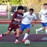 RYAN SPARKS | THE DAILY WORLD Montesano midfielder Cris Tobar (left) dribbles through the Rochester defense during a 1-0 loss on Tuesday in Montesano.