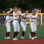 RYAN SPARKS | THE DAILY WORLD Montesano players (from left) Adda Potts, Lex Stanfield, Jaelyn Butterfield, Addi Kersker and Kennedy Campbell celebrate Butterfields diving catch during a 7-6 win over Rochester on Thursday at Montesano High School.