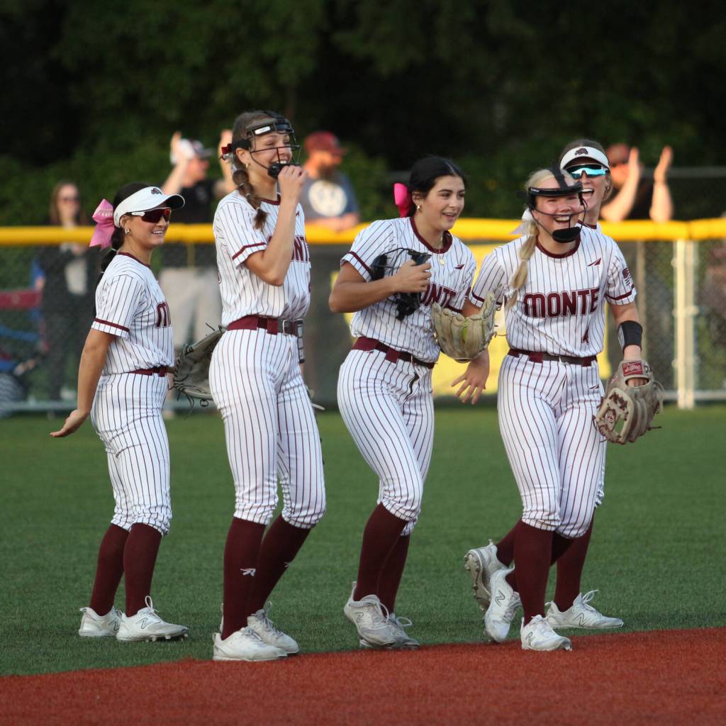 RYAN SPARKS | THE DAILY WORLD Montesano players (from left) Adda Potts, Lex Stanfield, Jaelyn Butterfield, Addi Kersker and Kennedy Campbell celebrate Butterfields diving catch during a 7-6 win over Rochester on Thursday at Montesano High School.