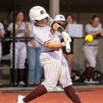 PHOTO BY FOREST WORGUM Montesano catcher Ali Parkin hammers a walk-off, three-run home run in the bottom of the seventh inning to give the Bulldogs a 7-6 win over Rochester on Thursday at Montesano High School.