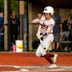 PHOTO BY FOREST WORGUM Montesano leadoff hitter Liv Robinson collects one of her two hits during a 7-6 win over Rochester on Thursday at Montesano High School.