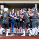 RYAN SPARKS | THE DAILY WORLD Rochesters Leah Hartley (11) celebrates with her teammates after hitting a game-tying home run in a 7-6 loss to Montesano on Thursday at Montesano High School.