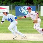 NICOLE SHANNON | MAIN FOCUS MEDIA Elmas Jack Alexander (left) leads off second while watched by Hoquiam shortstop Nite Turpin during a doubleheader on Friday in Elma.