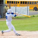 NICOLE SHANNON | MAIN FOCUS MEDIA Elmas T.J. Dunlap connects on a pitch during a doubleheader against Hoquiam on Friday in Elma.