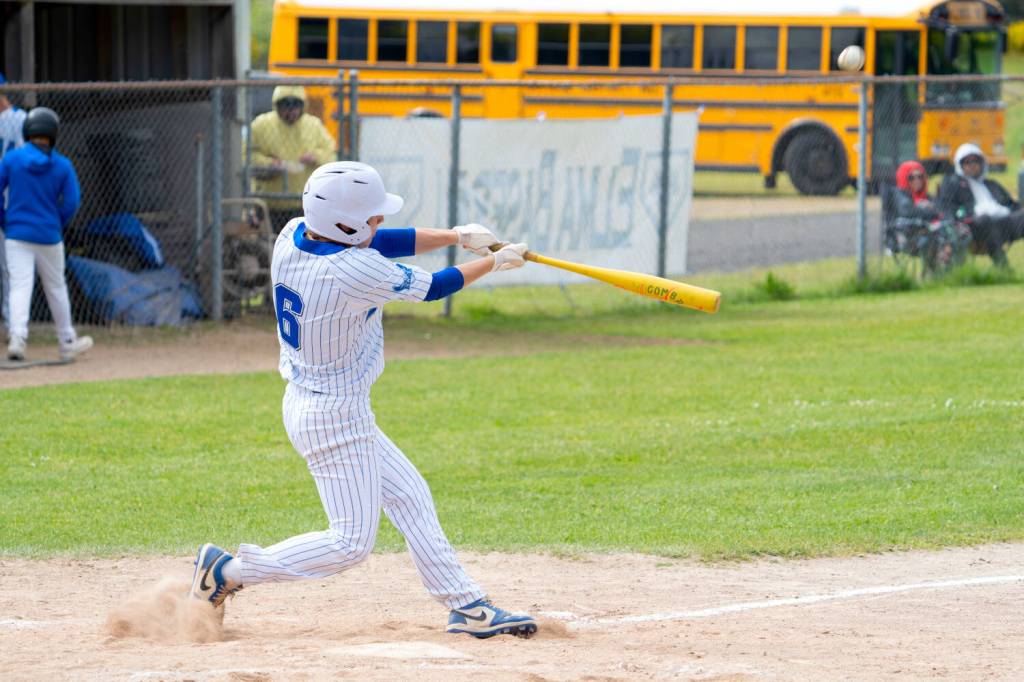 NICOLE SHANNON | MAIN FOCUS MEDIA Elmas T.J. Dunlap connects on a pitch during a doubleheader against Hoquiam on Friday in Elma.