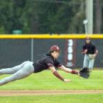 PHOTO BY FOREST WORGUM Montesanos Kolson Hendrickson makes a diving stop during a game against Bellevue Christian on Friday in Montesano.
