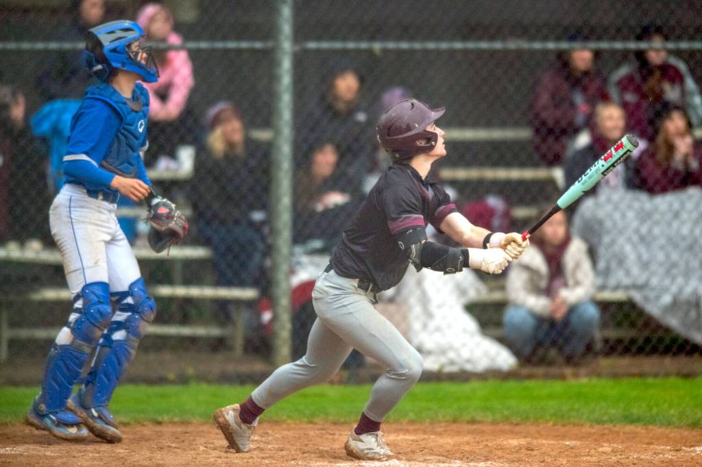 PHOTO BY FOREST WORGUM Montesanos Zach Timmons singles to drive in the winning run in a 7-6 victory over Bellevue Christian on Friday in Montesano.