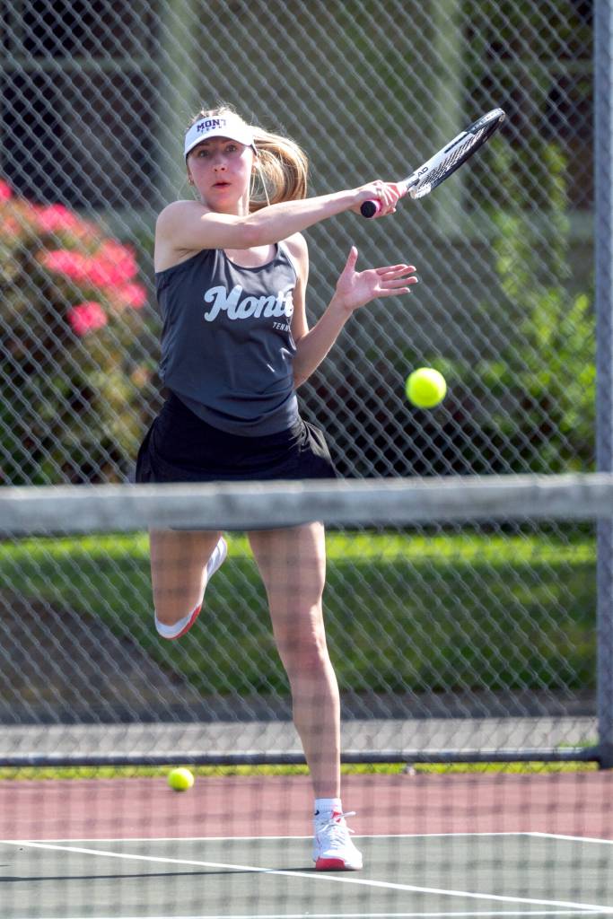 PHOTO BY FOREST WORGUM Montesano singles player Karissa Otterstetter smashes a forehand shot during a 5-1 victory over Tenino on Wednesday in Montesano. Otterstetter won her match 6-1, 6-2.
