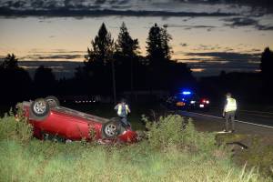 Ezra McCampbell / For The Daily World
A woman flipped her car after drifting off the side of the road near Lebam on Tuesday.